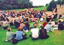 audience watching the play in the park